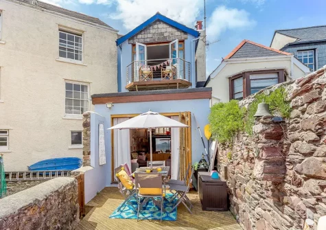 The decked patio, alfresco dining & outdoor sitting area at Fairwinds, Cawsand