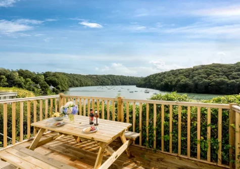 The decked patio & alfresco dining area at Fal River Cottage, Malpas