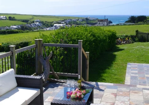 The patio, outdoor sitting area & garden at Farmlands, Porthcothan