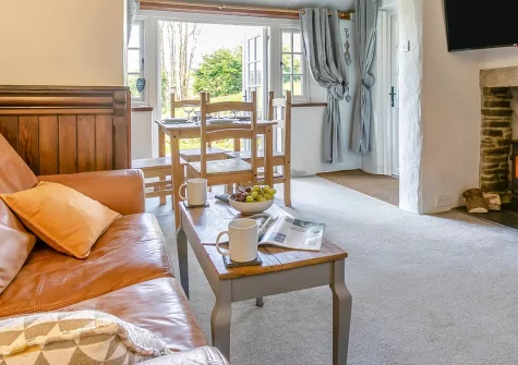 Farthings Cottage, Trefanny Hill is a traditional Cornish retreat with exposed beams and crackling wood burner. Perfect for families and dog-friendly with secure enclosed garden, near stunning south coast beaches and charming historic villages.