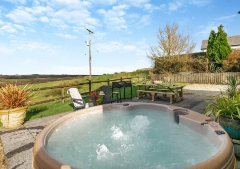 The patio, barbecue, alfresco dining area & hot tub at Fern Gully, Chilla