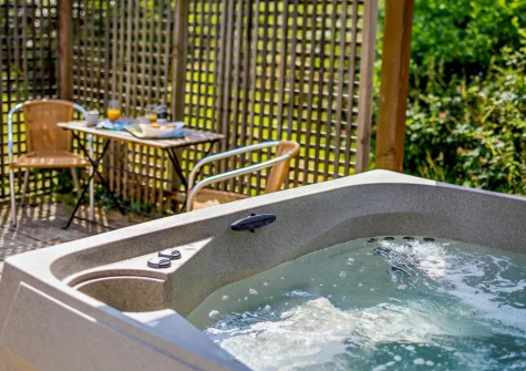 The decked patio, alfresco dining area & hot tub at Fern Pippin 4, Notter Mill Country Park, Notter