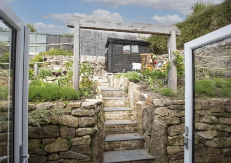 Step out into the tiered garden, with outdoor sitting areas, at Fernbank, Lelant