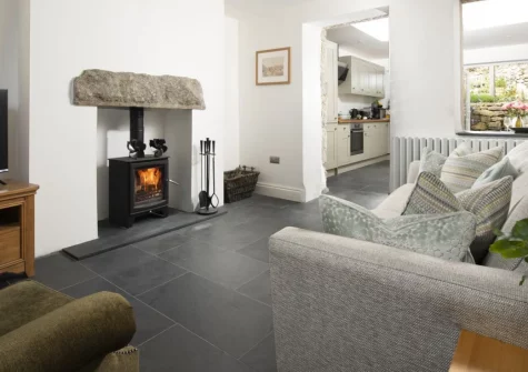 Fernbank, Lelant is a charming two-bedroom cottage in this peaceful coastal village, featuring a mature tiered garden with sunny terrace, two cosy living rooms with wood-burner, and easy access to St Ives, stunning beaches and coast path walks.