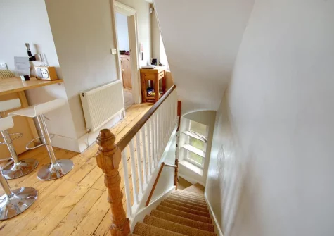 The stairs up from the ground floor to the kitchen at Ferndale House, Lynmouth