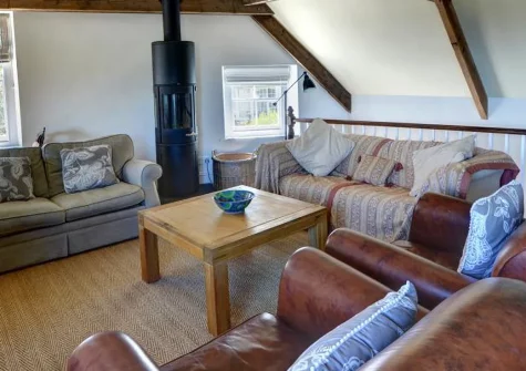 Ferndale House, Lynmouth is a characterful three-bedroom apartment with magnificent Bristol Channel views, original beams and vaulted ceilings, two balconies, and Exmoor National Park walks from the door in this picturesque harbour village.