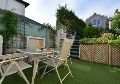 The enclosed rear garden & outdoor sitting area at Fernlea, Appledore