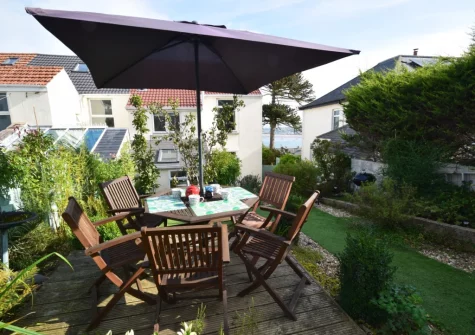 The enclosed garden, barbecue & alfresco dining area at Fernlea, Appledore