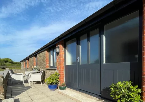 The patio & alfresco dining area at Firebeacon, Firebeacon Farm, Edistone