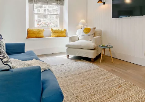Fishbones Cottage, St Ives is a characterful two-bedroom retreat blending Cornish charm with modern comfort. Enjoy the enclosed garden, window-seat views, and prime location near St Ives' galleries, beaches, and harbour. Perfect for a coastal break.