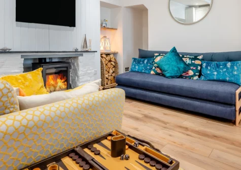 Fisherman's Cottage, Padstow is a beautifully restored two-bedroom retreat in the heart of the old town, featuring original stonework and beams, a cosy wood burner, and a private enclosed courtyard perfect for alfresco dining and relaxation.
