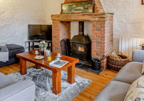 Fisherman's Rest at Blagdon Farm, Ashwater is a charming three-bedroom barn conversion in peaceful Devon countryside, featuring a private hot tub, woodland walks, coarse fishing lake, and shared games barn with easy access to both coasts.