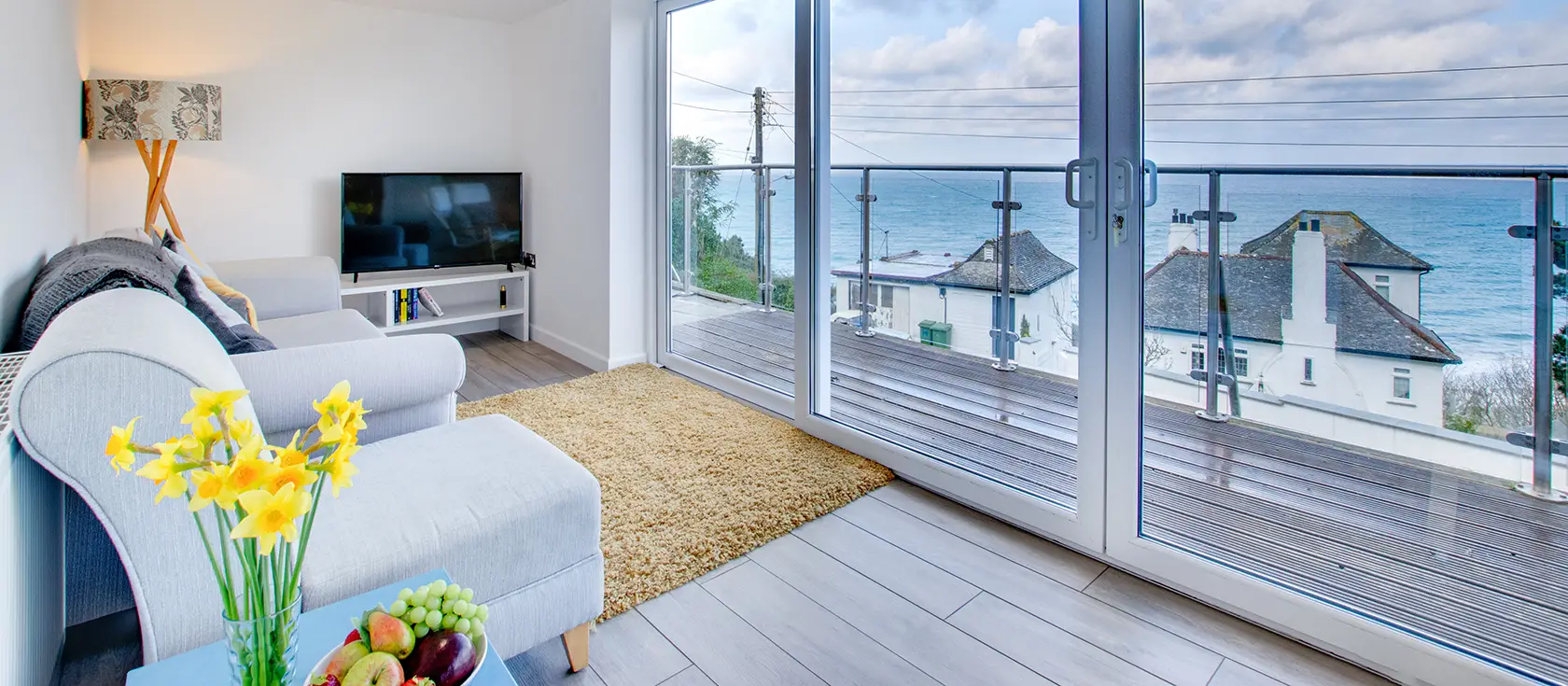 Flat 1, Holmesdale, Carbis Bay is an elegant two-bedroom apartment with panoramic bay views and private balcony. Enjoy contemporary comfort, sophisticated design, and beach access—the perfect Cornish coastal escape for memorable family holidays.