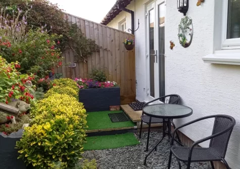 The rear garden & outdoor sitting area at Forget-me-not Bungalow, Seaton