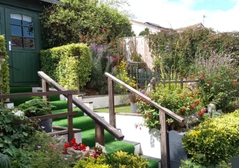 The attractive rear garden & summer house at Forget-me-not Bungalow, Seaton