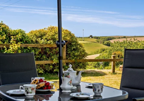 The alfresco dining area & enclosed lawned garden at Four Seasons, Crumplehorn