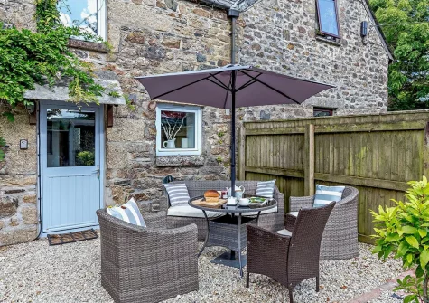 The patio & alfresco dining area at Foxes At Langoose, Lanhydrock