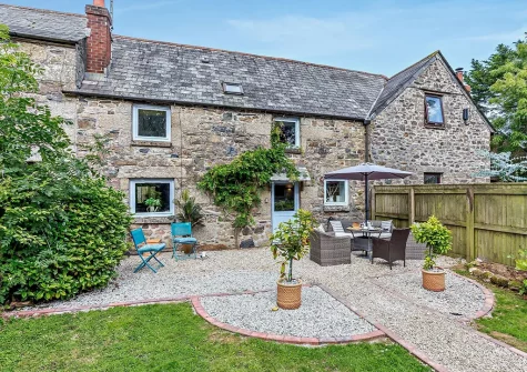The patio, alfresco dining area & garden at Foxes At Langoose, Lanhydrock
