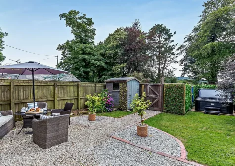 The patio, alfresco dining area, hot tub & garden at Foxes At Langoose, Lanhydrock