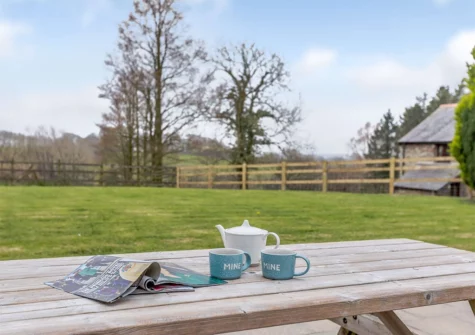 The alfresco dining area & garden at Foxglove Barn, Greylands Farm, Youldonmoor Cross