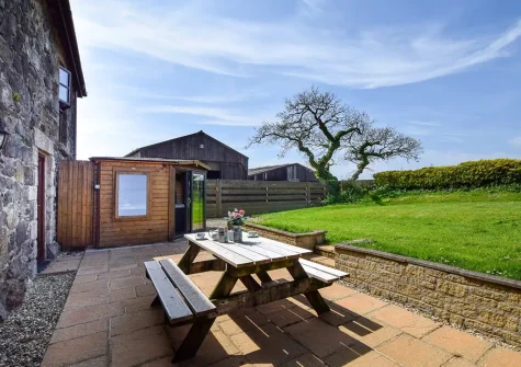 The patio, alfresco dining area & garden at Foxgloves, Higher Trenower Farm, Newtown-in-St-Martin