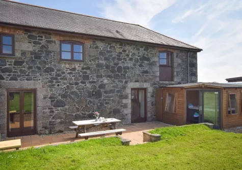 The patio, alfresco dining area & garden at Foxgloves, Higher Trenower Farm, Newtown-in-St-Martin