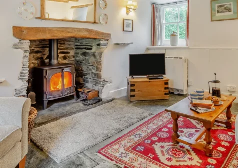 Frogapits, Boscastle is a characterful stone cottage in the heart of this historic harbour village, featuring a cosy wood burner, peaceful garden beside a babbling stream, and the dramatic South West Coast Path just 100 metres away.