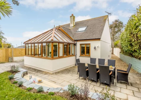 The patio, barbecue, alfresco dining area & enclosed garden at Garden House, Bude