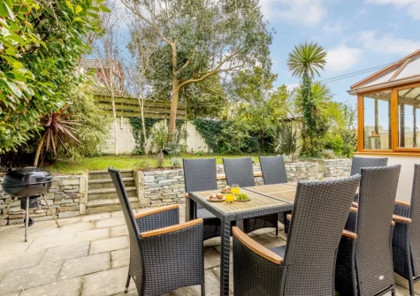 The patio, barbecue, alfresco dining area & enclosed garden at Garden House, Bude