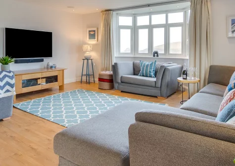 Garendon, Trevone is a magnificent five-bedroom house with stunning bay views and beach access. Perfect for larger groups, featuring a hot tub, pool table, and outdoor spaces for unforgettable coastal holiday memories with family and friends.