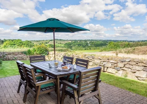 The patio, barbecue, alfresco dining area & enclosed garden at Geevor, Germoe
