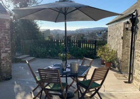 The patio & alfresco dining area at Gewans Farm Cottage, Tregorrick