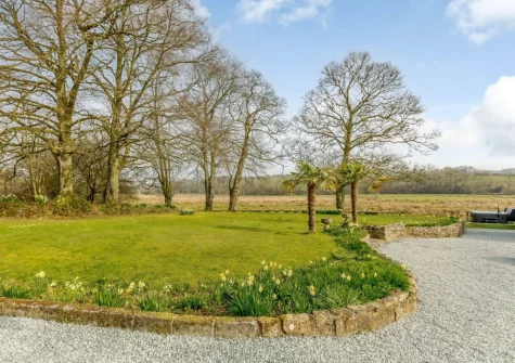 The beautifully manicured garden at Gidcott Cottage, Gidcott