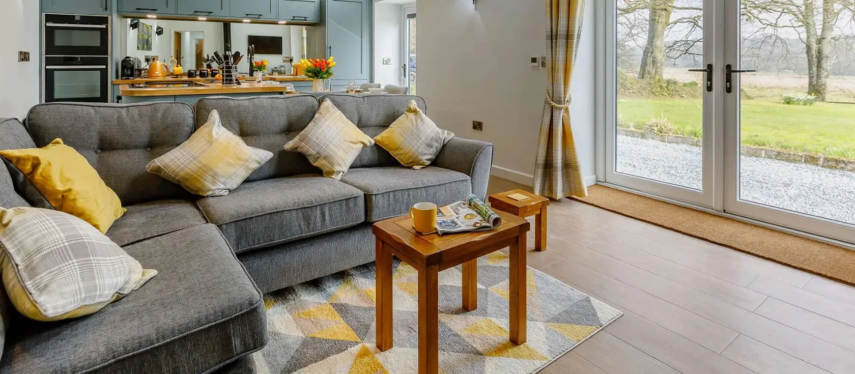 Gidcott Cottage, Gidcott is a luxurious two-bedroom barn conversion featuring a private hot tub and streamside setting. Explore Devon and Cornwall's stunning coast and countryside from this beautifully peaceful rural retreat, perfect for couples.