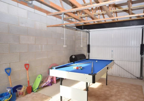 The games room with pool table at Gifford Close Bungalow, Hartland