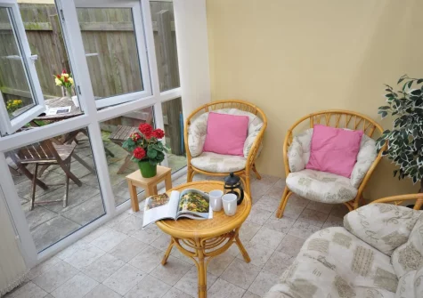 The sunny conservatory at Gifford Close Bungalow, Hartland