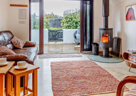 Gillyflower at South Tofrey Farm, Golant is a charming two-bedroom cottage boasting a private hot tub, shared indoor pool, sauna and games room, set within a peaceful riverside village near Fowey, Eden Project and Cornwall's finest coastal towns.