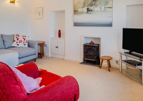 Glanmor North, Polruan is a characterful three-bedroom stone cottage in the heart of this picturesque fishing village, featuring waterside views across Fowey Estuary, a generous sun terrace, and the South West Coast Path right from your doorstep.