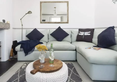 Glas Mor, Mousehole is a charming three-storey Cornish cottage boasting sweeping sea views over St Michael's Mount, cosy interiors with a crackling log burner, and a peaceful spot just a short, meandering stroll from the harbour and village life.