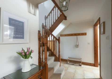 The hallway & stairs up to the first floor at Godolphin at Roserrow, Polzeath