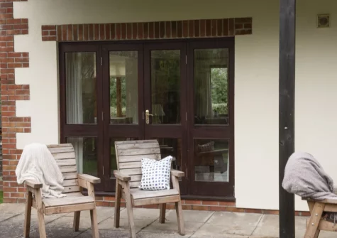 The patio & outdoor sitting area at Godolphin at Roserrow, Polzeath