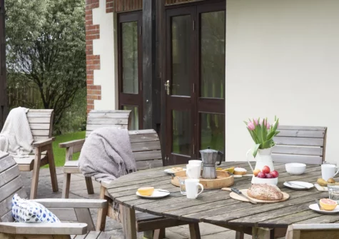 The patio, barbecue & alfresco dining area at Godolphin at Roserrow, Polzeath