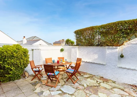 The enclosed patio garden & alfresco dining area at Godrevy Watch, Carbis Bay