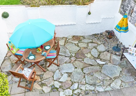 The enclosed patio garden & alfresco dining area at Godrevy Watch, Carbis Bay