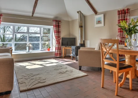 Goosehill at Penrose Burden, St Breward is a peaceful ground-floor barn conversion sleeping four, with stunning Camel Valley views, luxury Hypnos beds, cosy wood burner, and direct access to Bodmin Moor's Dark Sky landscapes and the Camel Trail.