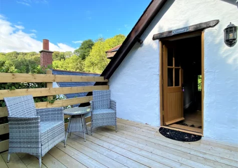 The private enclosed decked patio & outdoor sitting area at Granary Cottage at Heddon Valley Mill, Killington
