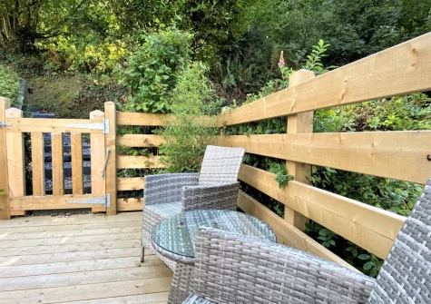 The private enclosed decked patio & outdoor sitting area at Granary Cottage at Heddon Valley Mill, Killington