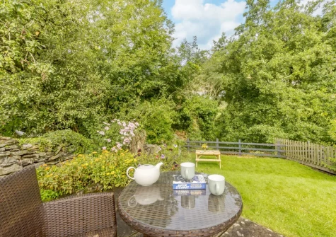 The garden, outdoor sitting & alfresco dining area at Granary Cottage, Swimbridge