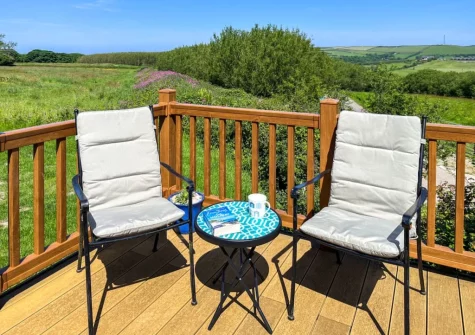 The decked terrace & outdoor sitting area at Grandma's Stick House at Mullacot Park, Mullacott