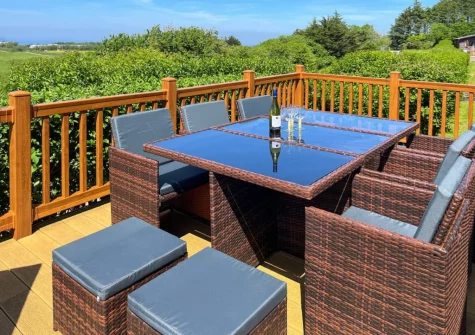 The decked terrace & alfresco dining area at Grandma's Stick House at Mullacot Park, Mullacott